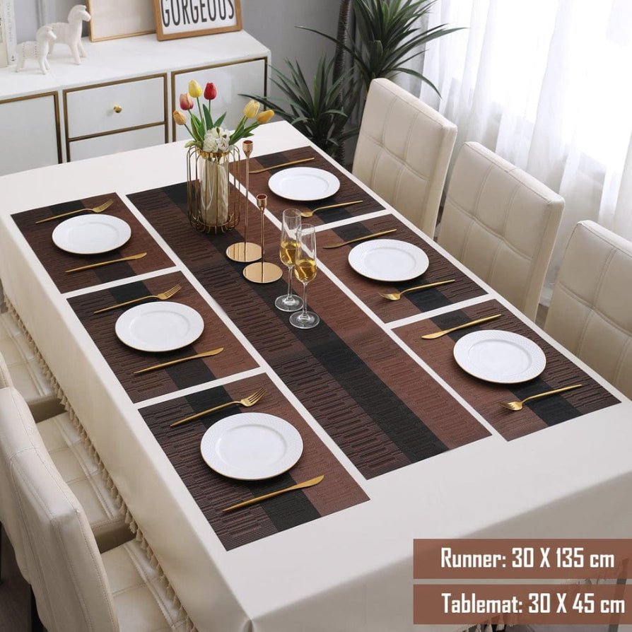 Dining table set with placemats, plates, and cutlery in a well-lit room.