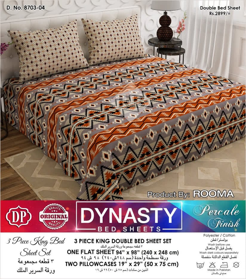 Bed sheet set with geometric pattern on a bed, featuring Rooma Dynasty branding.